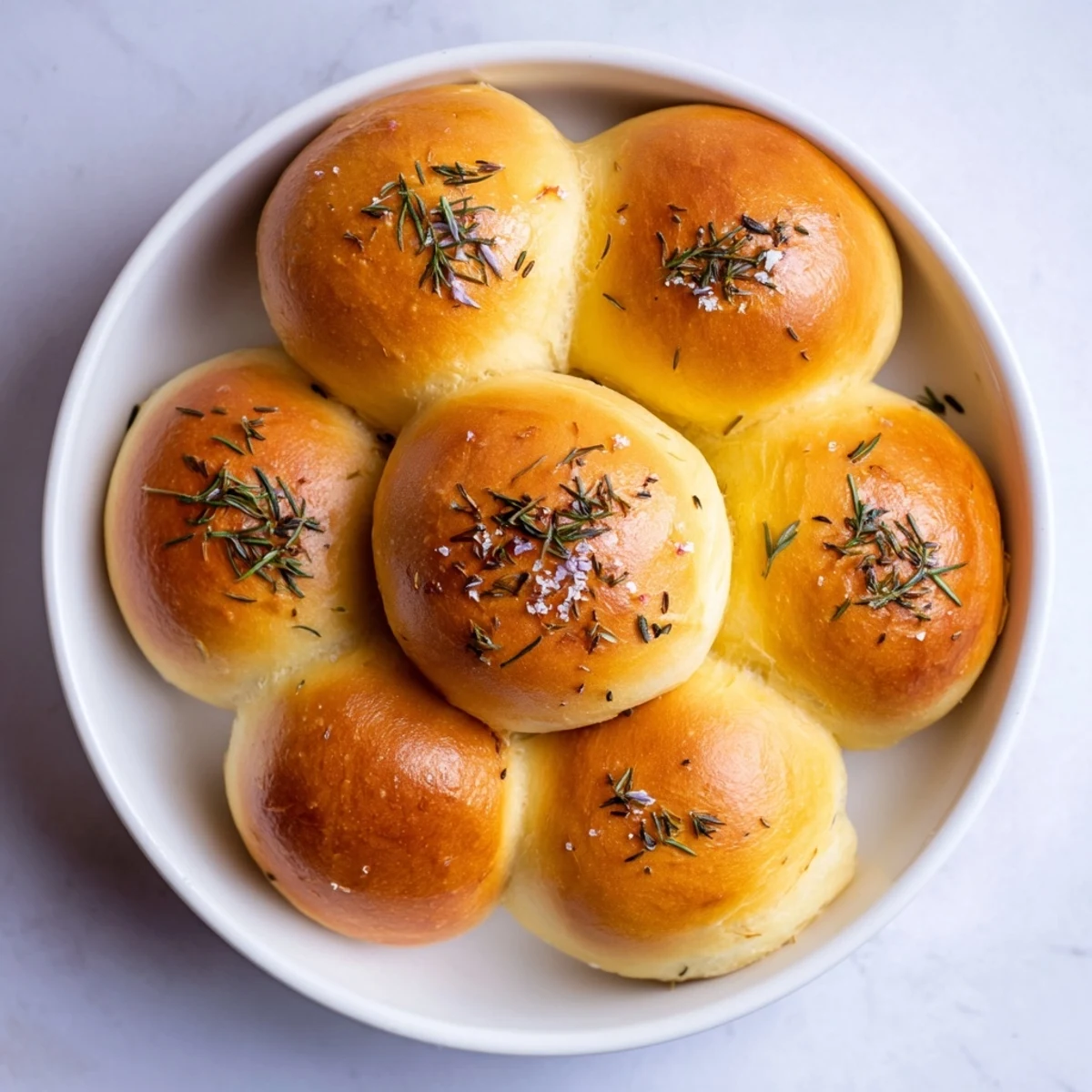 Warm, chewy quick homemade flatbread glistening with olive oil, rosemary, and sea salt, perfect.