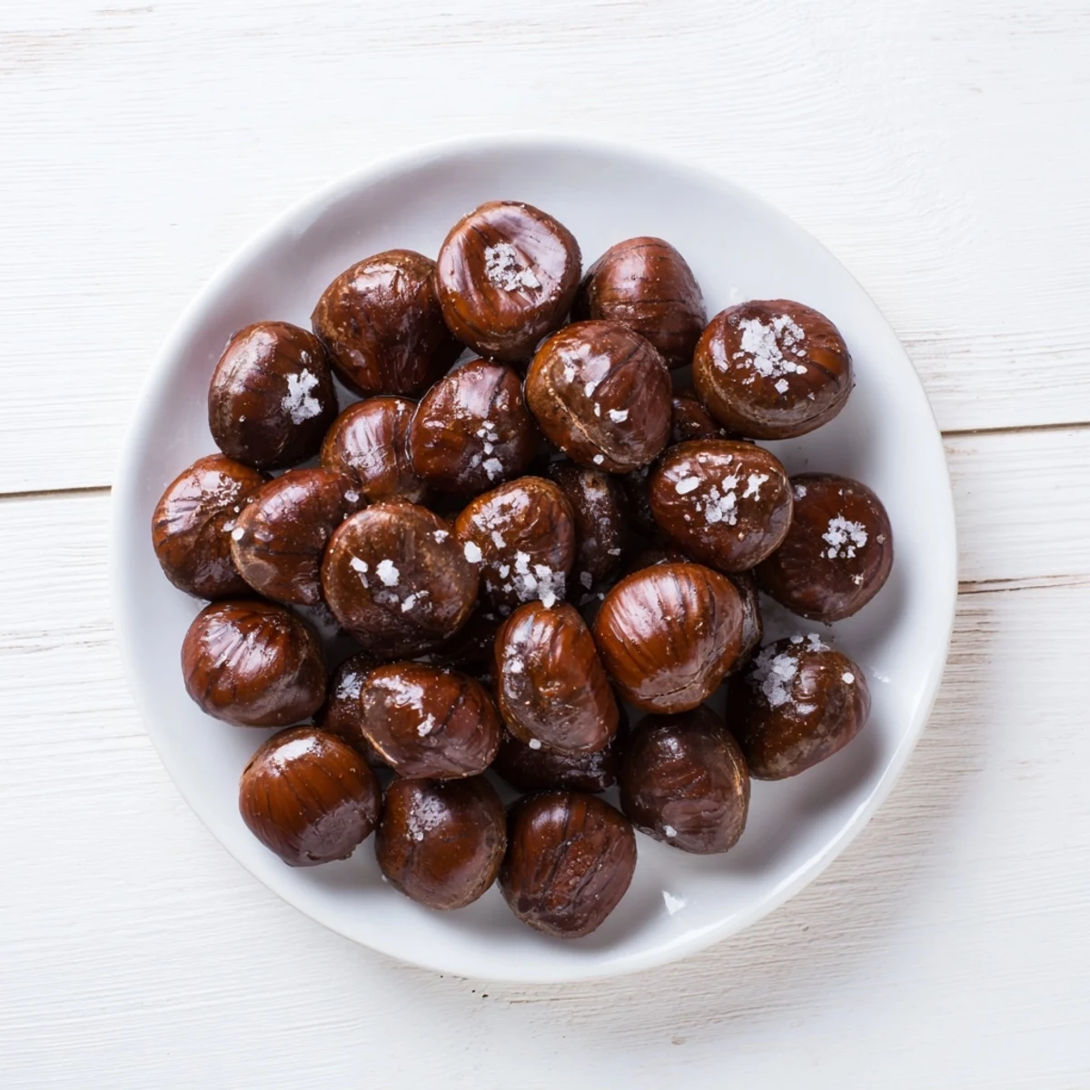 A bowl overflowing with crunchy, oven-fresh sweet and salty honey toasted cashews, ready to enjoy.