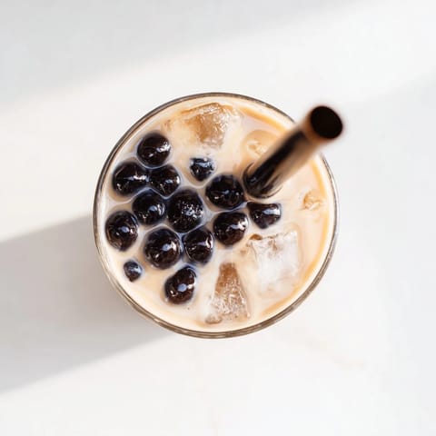 Chilled glasses filled with chewy tapioca pearls and creamy Boba Tea Hack – Instant Bubble Tea with Sweetened Condensed Milk, ready to sip.