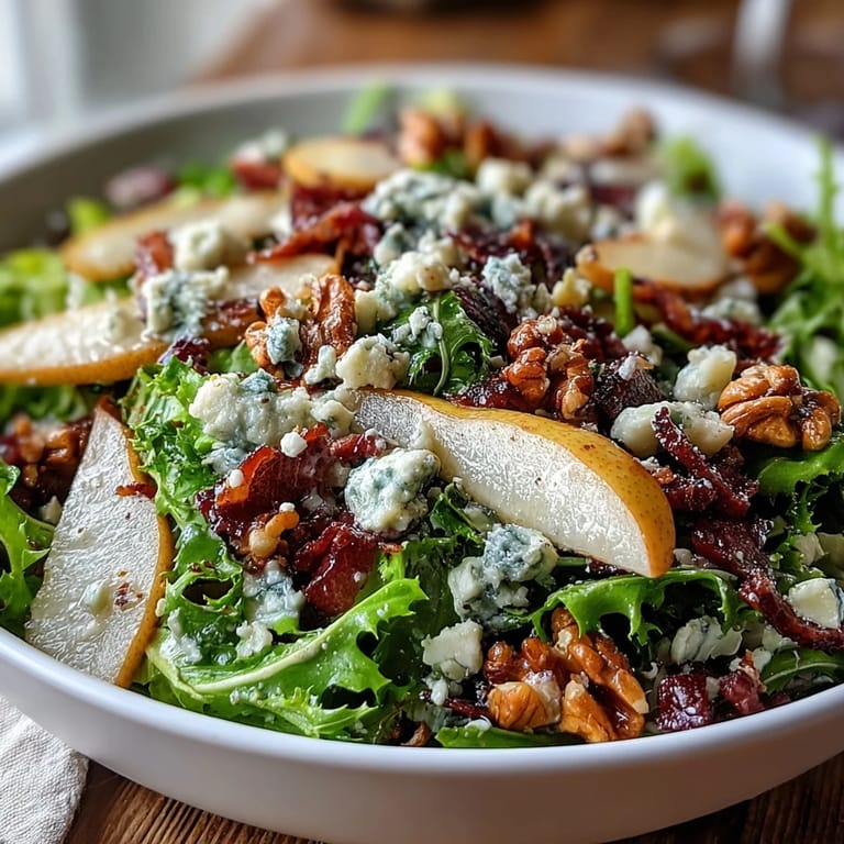 This Frisée Pear Blue Cheese Bowl salad balances tangy blue cheese and sweet pears with crunchy, salty prosciutto pieces.