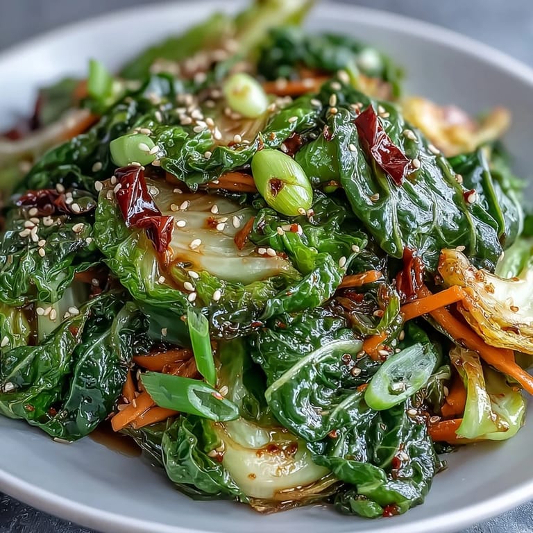A delicious Spicy Cabbage Stir Fry, perfectly wilted, served with a sprinkle of toasted sesame.